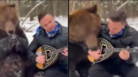 Λαρισαίος έγινε viral παίζοντας μπουζούκι στα χιόνι με μια αρκούδα δίπλα του να τον γλείφει (ΒΙΝΤΕΟ)