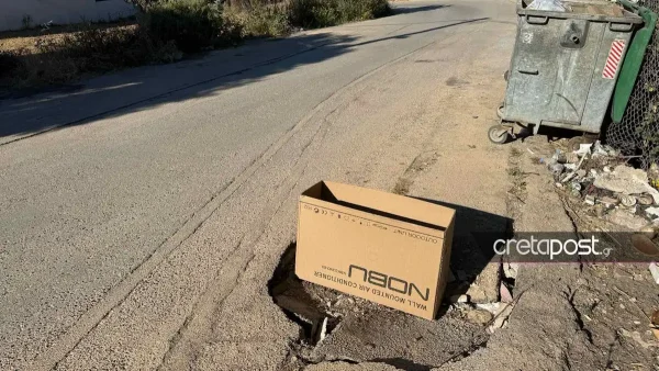 Ηράκλειο: «Μπάλωσαν» μεγάλη λακκούβα στο δρόμο με χαρτόκουτο