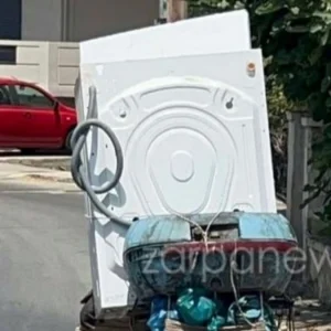 Μετέφερε ολόκληρο πλυντήριο πάνω σε... μηχανή! (ΒΙΝΤΕΟ)