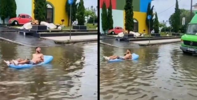 Βγήκε… με φουσκωτό και κοκτέιλ σε πλημμυρισμένο δρόμο!